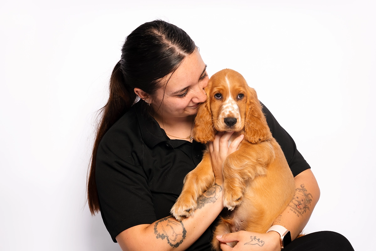 Pets In The City staff member with cocker spaniel puppy